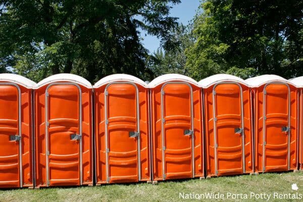 a lineup of clean and well-maintained portable loos for workers in Tracy City, TN