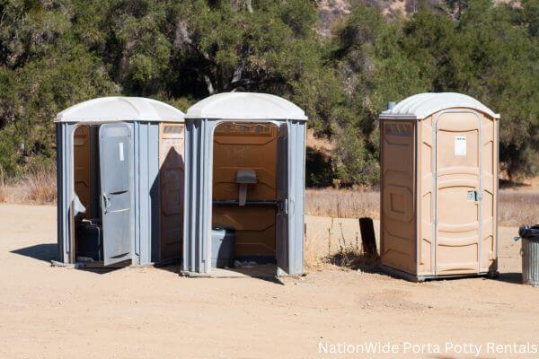 a clean row of portable restrooms for outdoor weddings or festivals in Greenback, TN